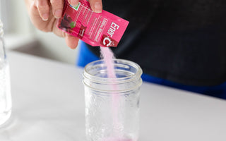 Ener-C  sachet raspberry multivitamin drink mix pouring