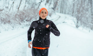 Woman running snow exercise outdoors
